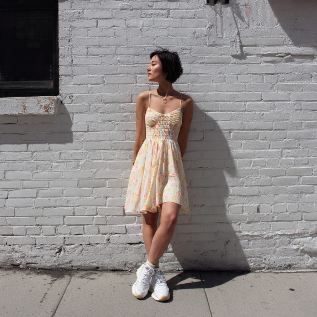 13 Summer Outfit Ideas That Make Getting Dressed in the Heat Actually Fun 2 Flowy Sundress + White Sneakers
