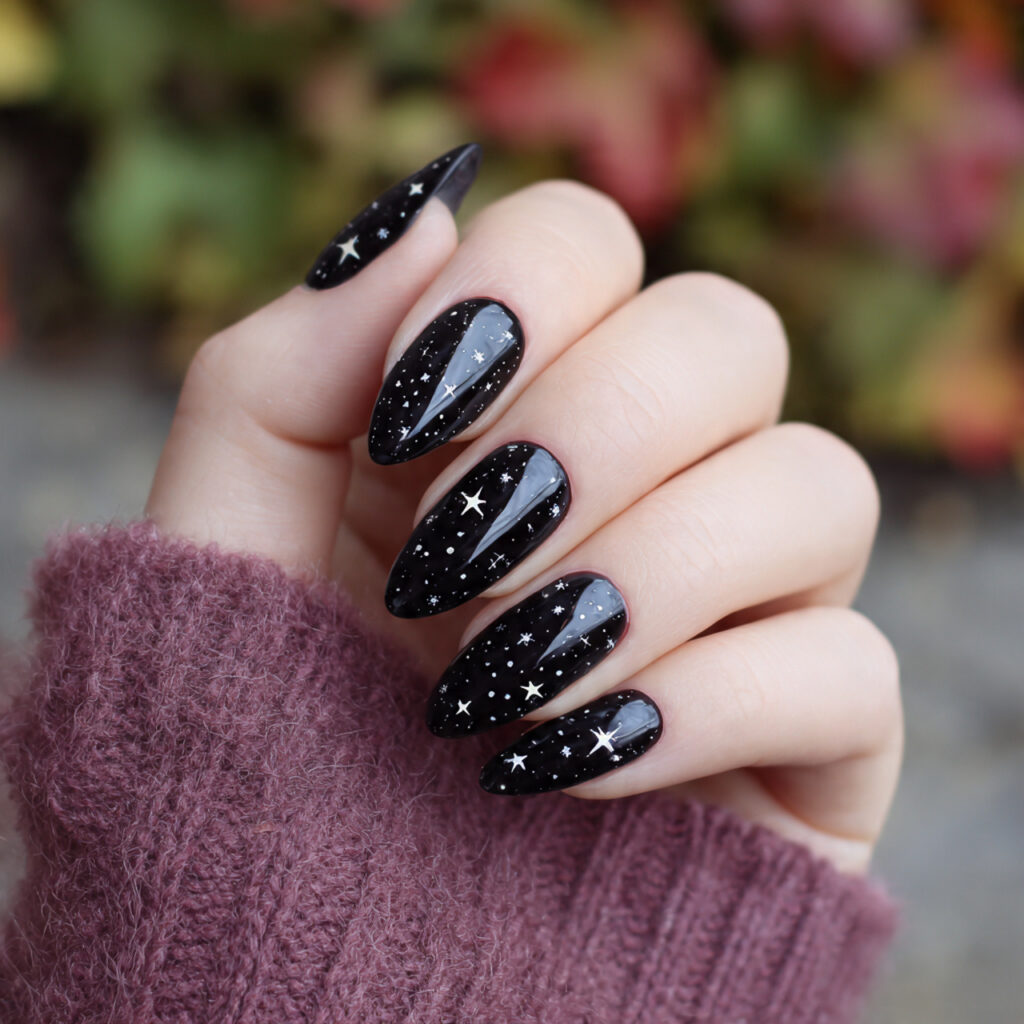 black almond nails with tiny stars