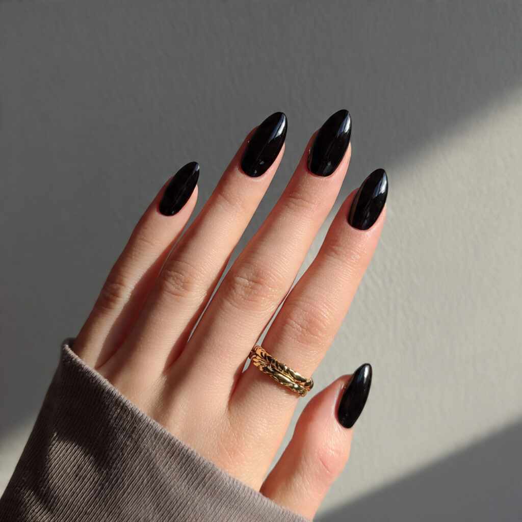 14 Short Oval Nails That Are Cute, Chic, and Seriously Easy to Wear Right Now 15 black minimal oval nails