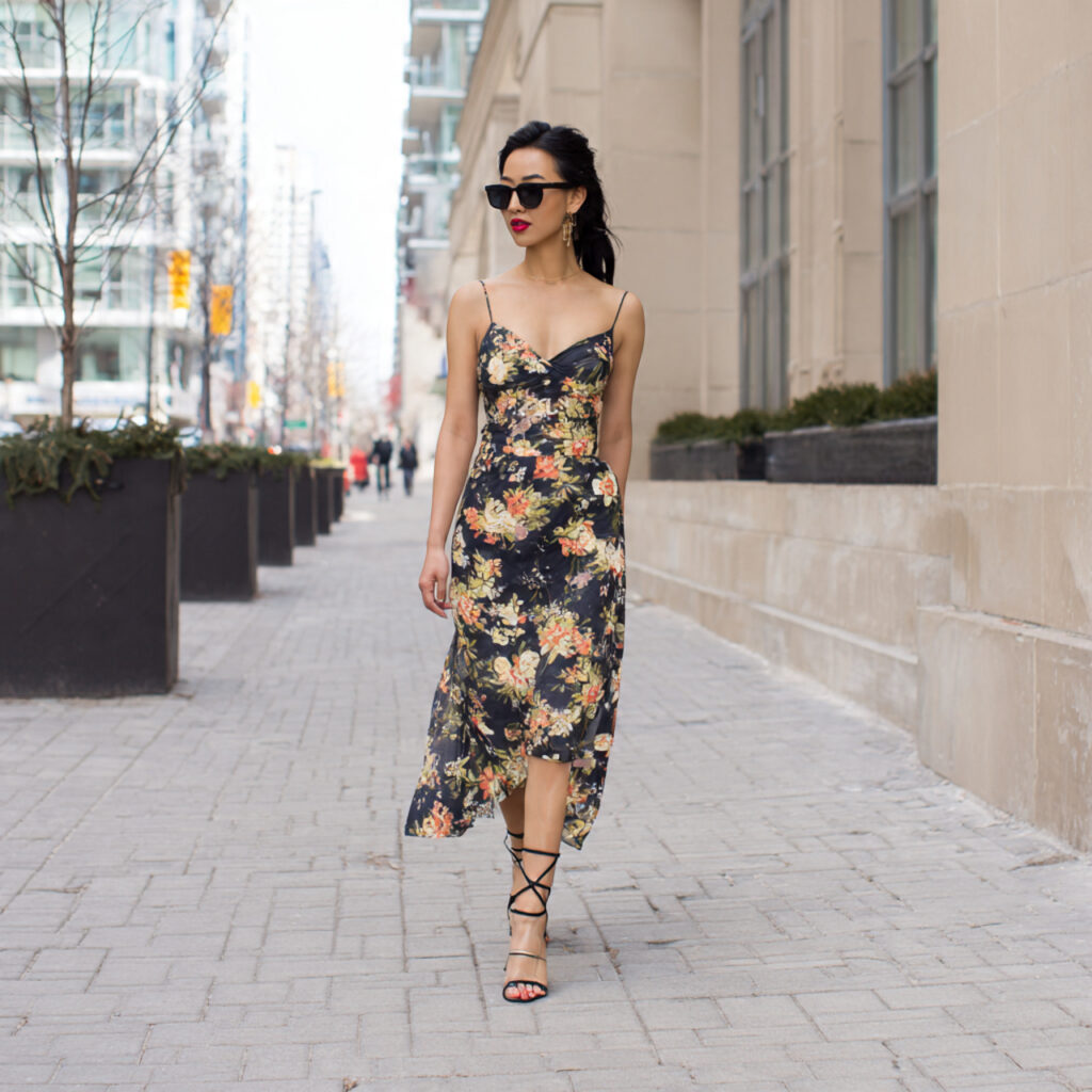 13 Graduation Outfit Ideas That Will Make You Look Main Character-Level Chic 4 floral midi dress strappy sandals with graduation
