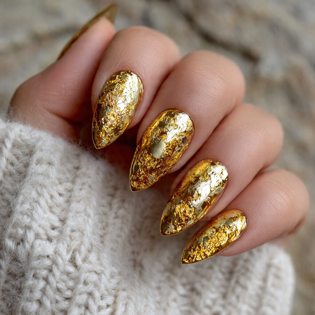 15 Almond Acrylic Nails That Instantly Elevate Your Style (And the Outfits That Look Amazing With Them) 14 gold foil almond acrylic nails chic evening outfit