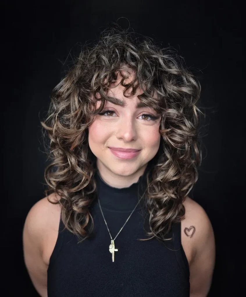 15 Concert Hairstyle Ideas That Look Cute, Last All Night, and Survive the Encore 14 Curly Hair With Statement Clips