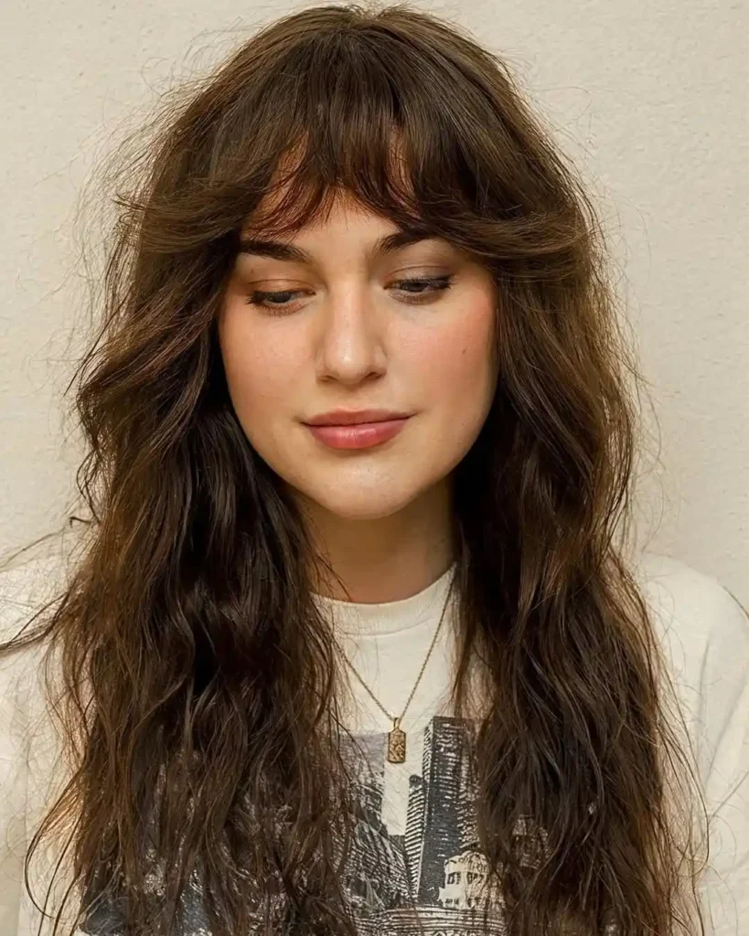 15 Round Face Hairstyles Ideas That Make Your Features Look Extra Chic 7 Long Shag With Wispy Bangs
