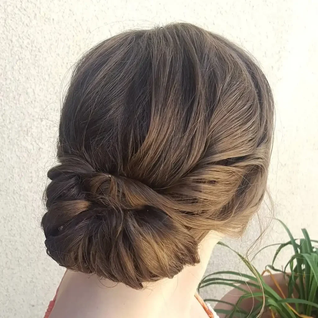 16 Easy Short Hair Updos That Look Fancy but Take Basically Zero Effort 14 Low Rolled Updo