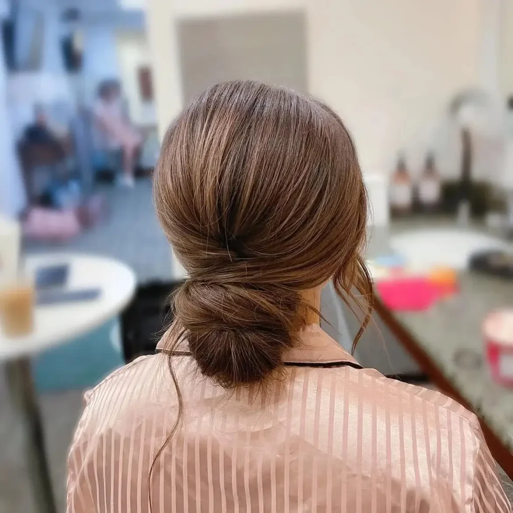 15 Wedding Hairstyles for Long Hair That Look Luxe, Romantic, and Totally Effortless 4 Low Textured Bun