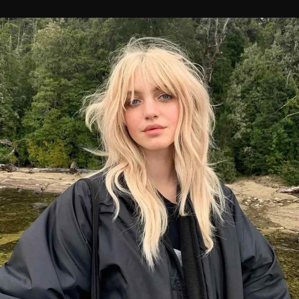15 Hairstyles With Bangs That Instantly Make You Look Cooler 4 Messy Shag With Wispy Bangs