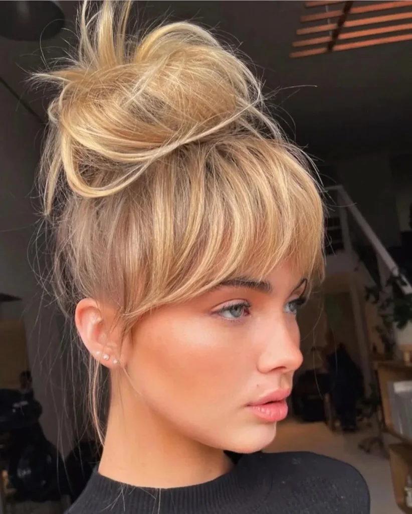 15 Round Face Hairstyles Ideas That Make Your Features Look Extra Chic 16 Messy Top Knot