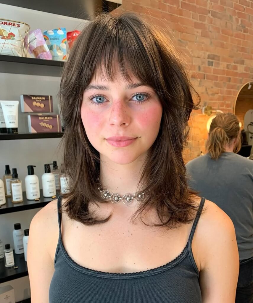 15 Short Hair Wolf Cut Styles That Will Make You Want to Chop It All Off (Trust Me, It’s Worth It) 5 Messy Wolf Cut with Blunt Bangs
