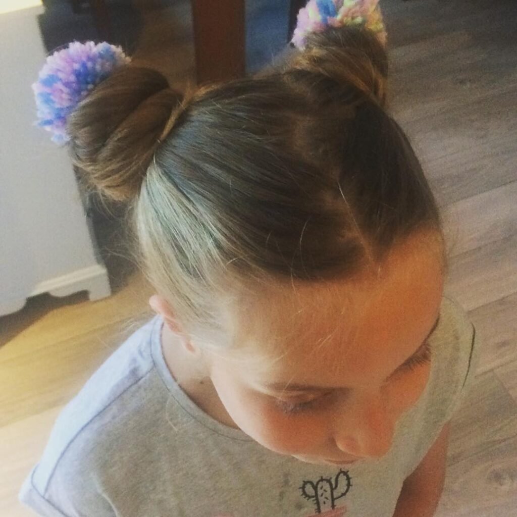 17 Stylish Toddler Hairstyles That Will Make You Want to Try Them Too 11 Pom Pom Buns