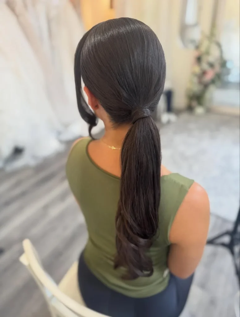 16 Easy Short Hair Updos That Look Fancy but Take Basically Zero Effort 7 Sleek Low Pony With Tucked Ends
