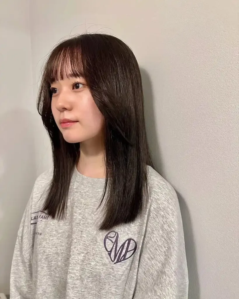 15 Hairstyles With Bangs That Instantly Make You Look Cooler 14 Straight Hair With Korean Inspired Bangs