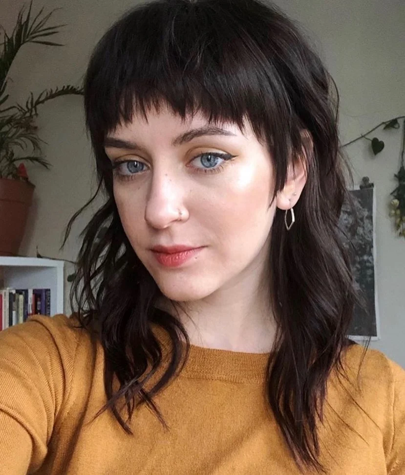 15 Hairstyles With Bangs That Instantly Make You Look Cooler 16 Wolf Cut With Choppy Bangs