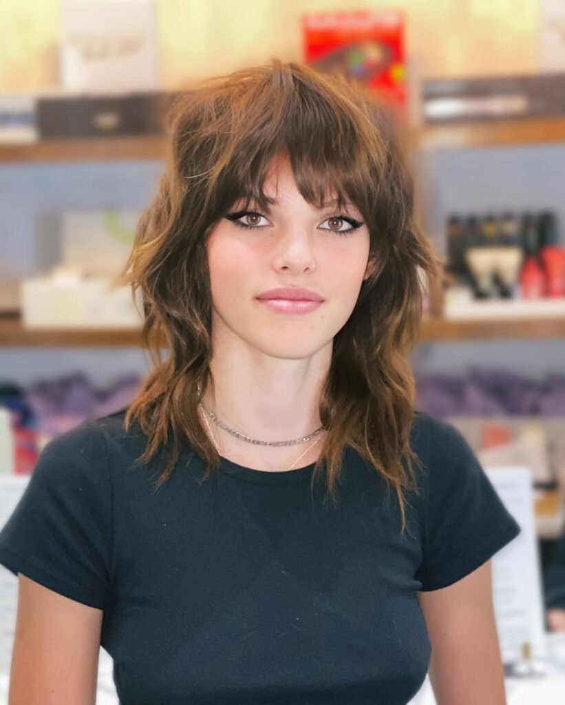 15 Short Hair Wolf Cut Styles That Will Make You Want to Chop It All Off (Trust Me, It’s Worth It) 9 Wolf Cut with Curly Fringe