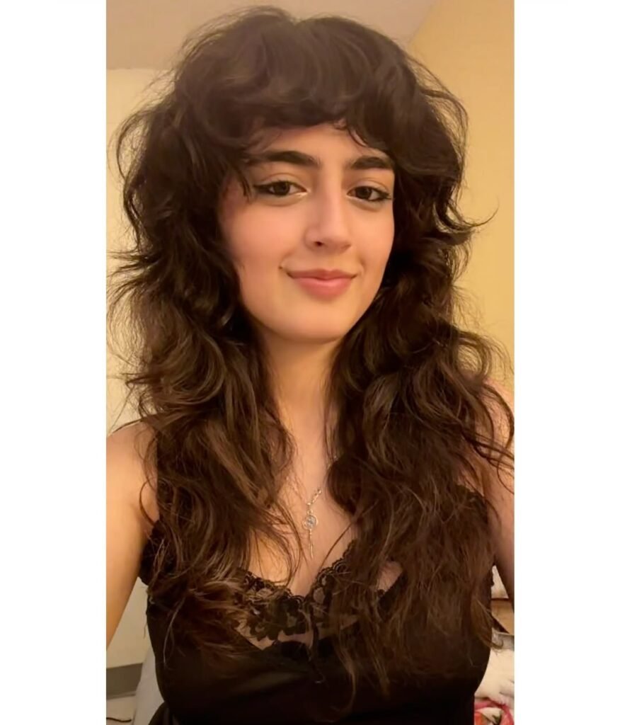 15 Short Hair Wolf Cut Styles That Will Make You Want to Chop It All Off (Trust Me, It’s Worth It) 10 Wolf Cut with Tousled Layers Soft Curtain Bangs