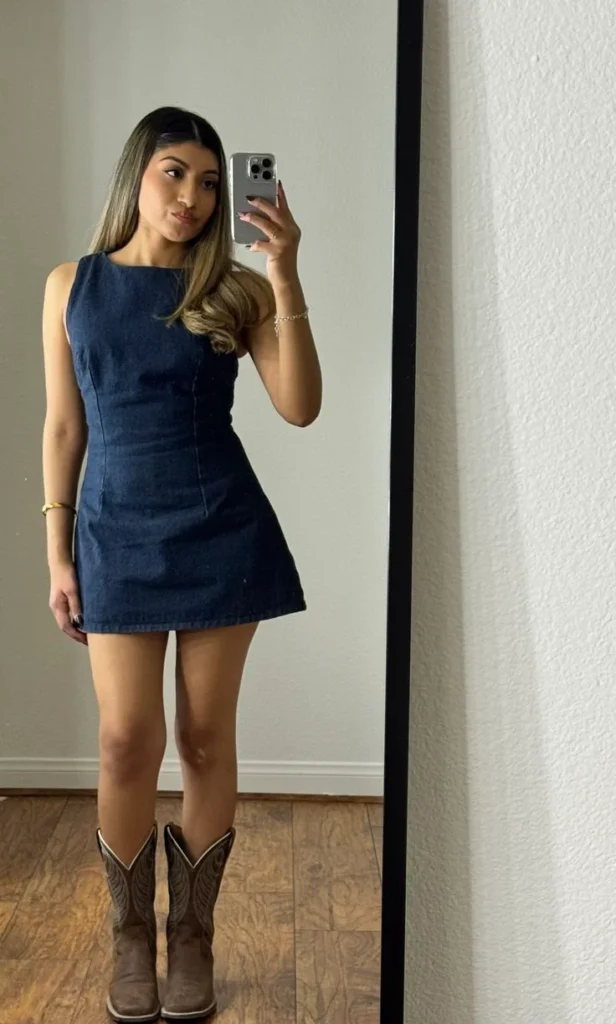 16 Denim Dress Outfit Ideas That Make Getting Dressed Look Effortlessly Cool 3 Fitted Denim Mini Dress with Cowboy Boots