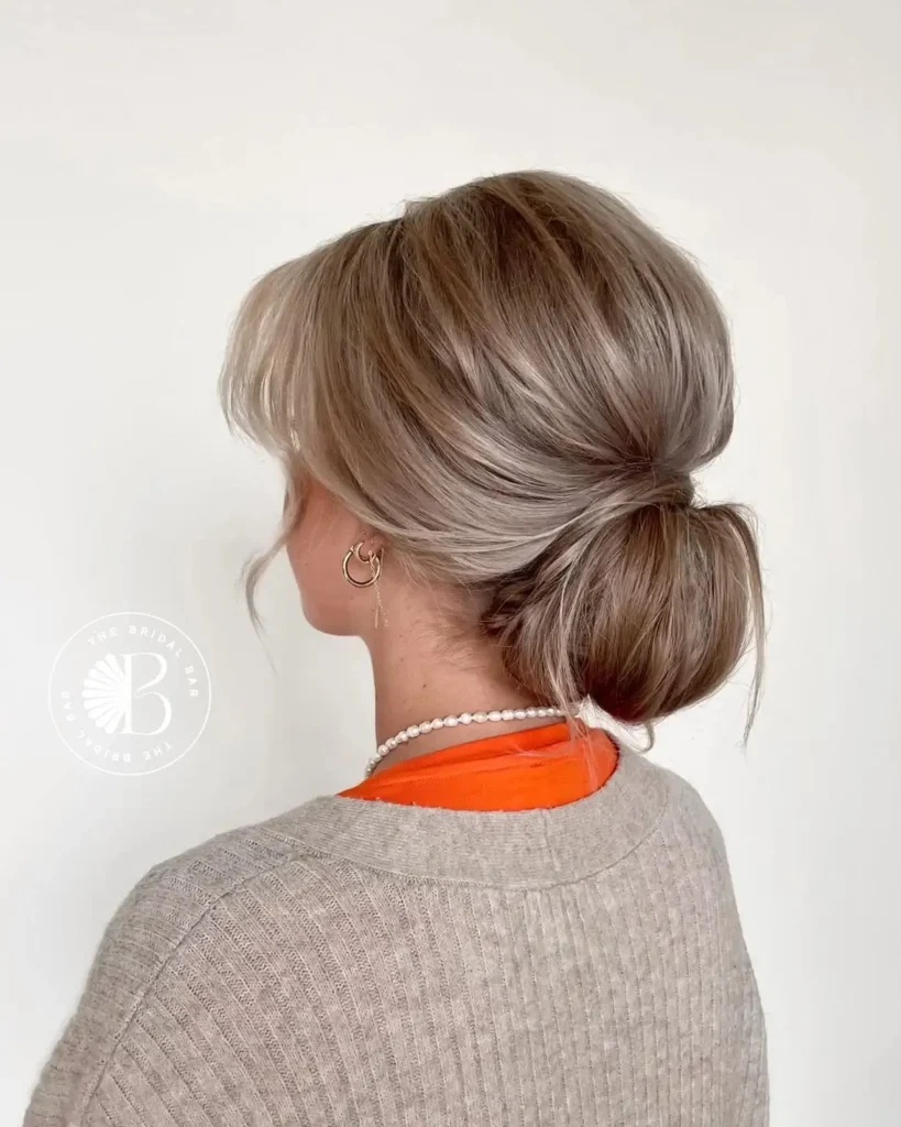 15 Elegant Hairstyle Ideas That Make You Look Expensive Without Trying Too Hard 15 Loose Low Chignon