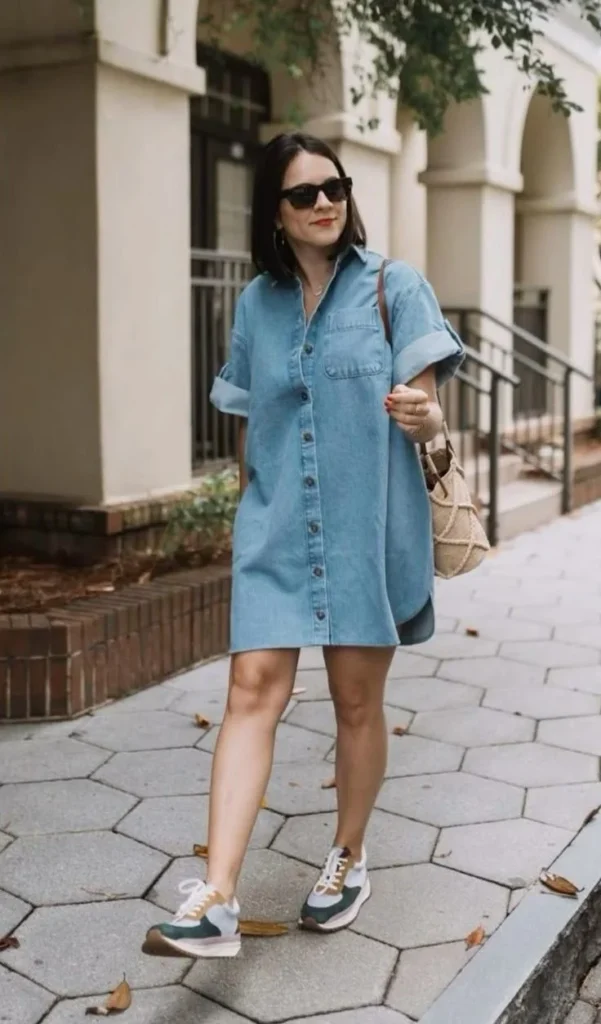 16 Denim Dress Outfit Ideas That Make Getting Dressed Look Effortlessly Cool 9 Oversized Denim Dress with Chunky Sneakers