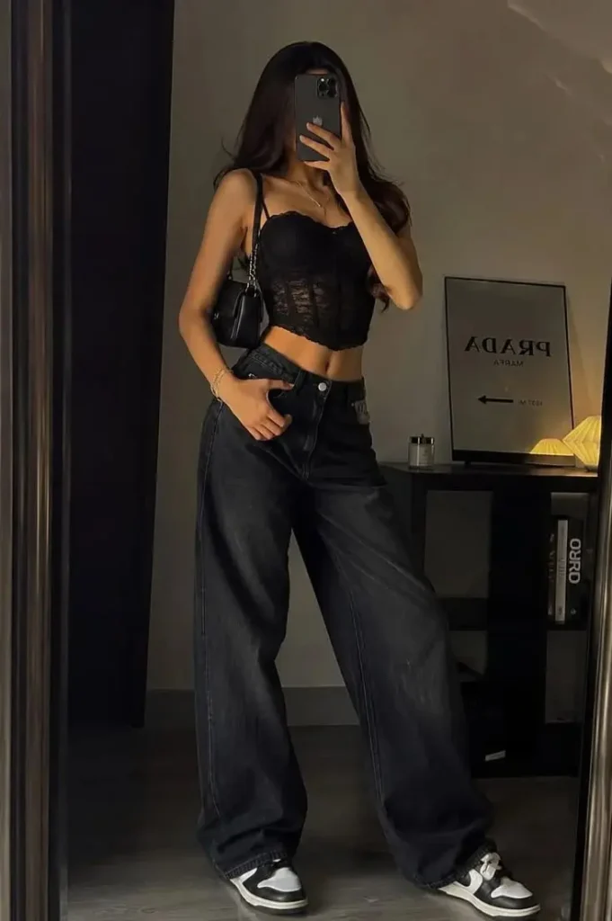 17 Black Outfit Ideas That Make You Look Effortlessly Expensive 9 Black Corset Top Baggy Jeans