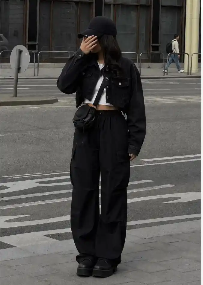 17 Black Outfit Ideas That Make You Look Effortlessly Expensive 12 Black Denim Jacket Cargo Pants