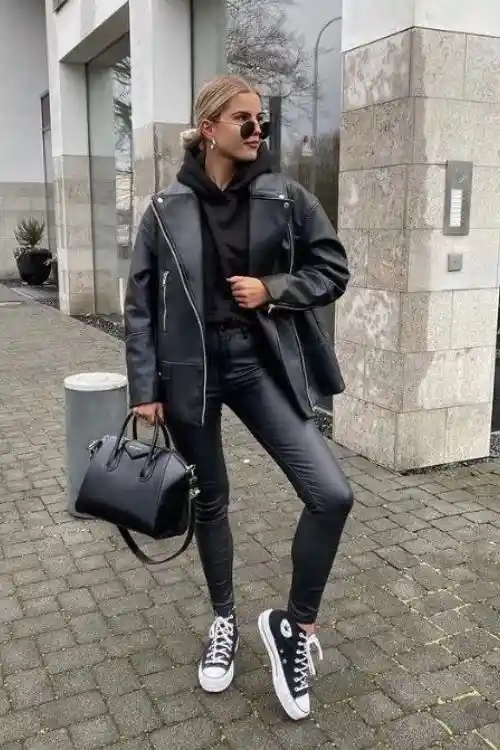17 Black Outfit Ideas That Make You Look Effortlessly Expensive 8 Black Hoodie Faux Leather Leggings