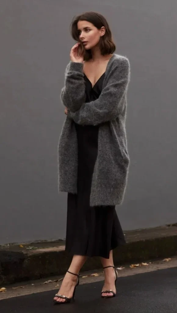 17 Black Outfit Ideas That Make You Look Effortlessly Expensive 4 Black Slip Dress Oversized Cardigan
