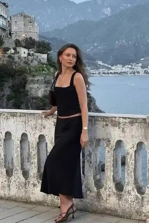 17 Black Outfit Ideas That Make You Look Effortlessly Expensive 11 Black Tank Top Satin Midi Skirt