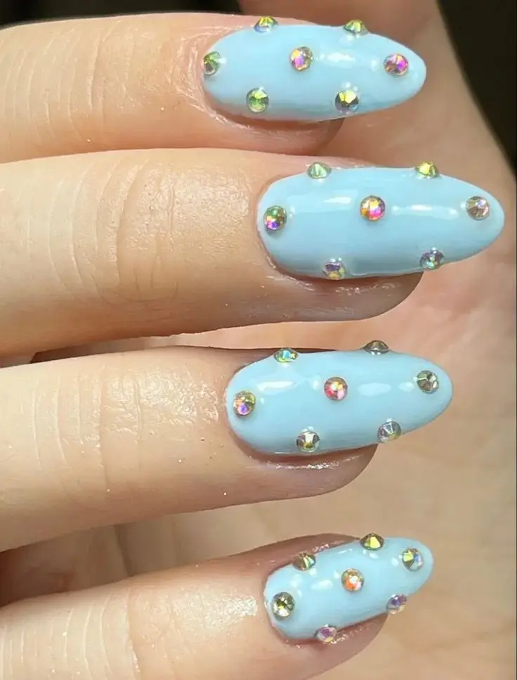 16 Blue Chrome Nails That Look Expensive, Cool, and Main Character Approved 9 Blue Chrome Nails With Rhinestones