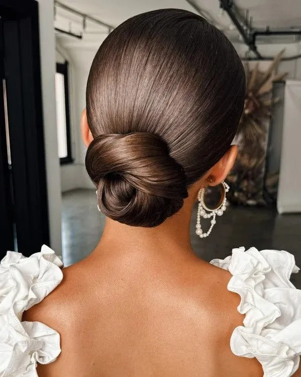 17 Low Bun Hairstyles That Look Effortlessly Chic Without Trying Too Hard 2 Classic Sleek Low Bun