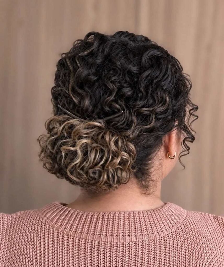 17 Low Bun Hairstyles That Look Effortlessly Chic Without Trying Too Hard 9 Curly Low Bun