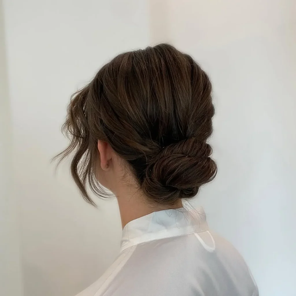17 Low Bun Hairstyles That Look Effortlessly Chic Without Trying Too Hard 4 Low Bun With Face Framing Pieces
