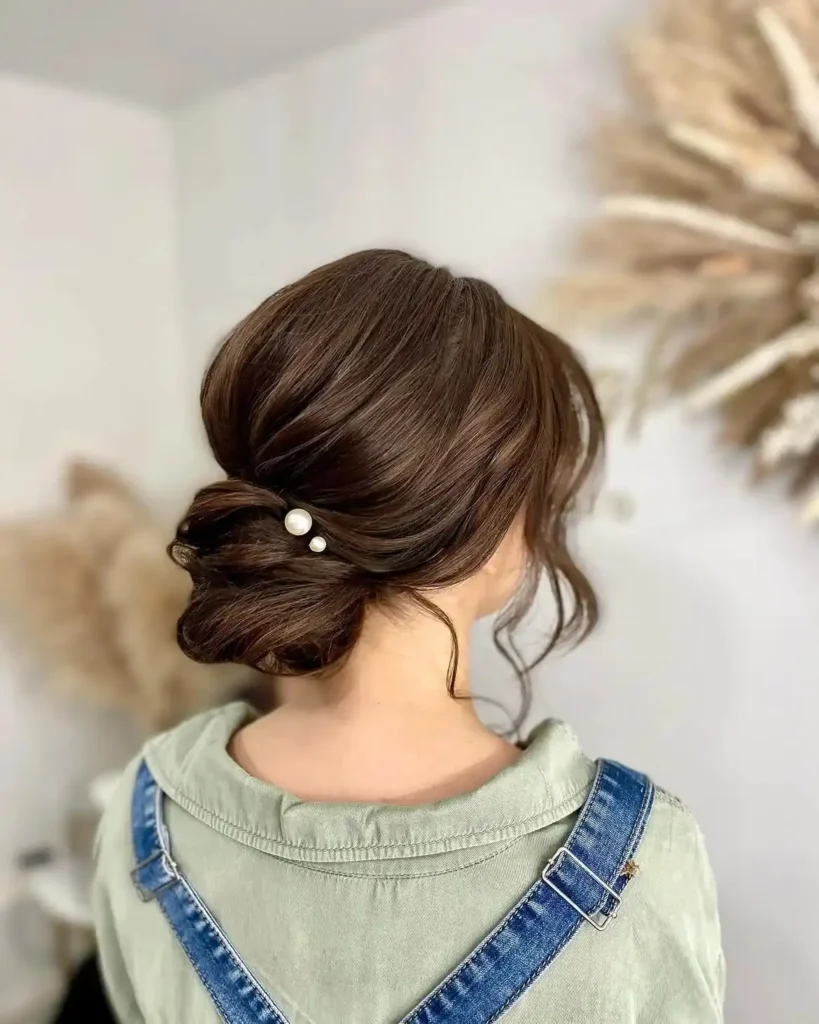 17 Low Bun Hairstyles That Look Effortlessly Chic Without Trying Too Hard 12 Low Bun With Pearls