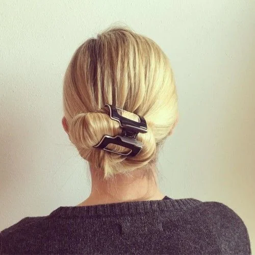 17 Low Bun Hairstyles That Look Effortlessly Chic Without Trying Too Hard 11 Low Bun With a Claw Clip