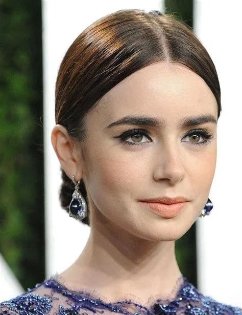 17 Low Bun Hairstyles That Look Effortlessly Chic Without Trying Too Hard 8 Low Bun With a Middle Part