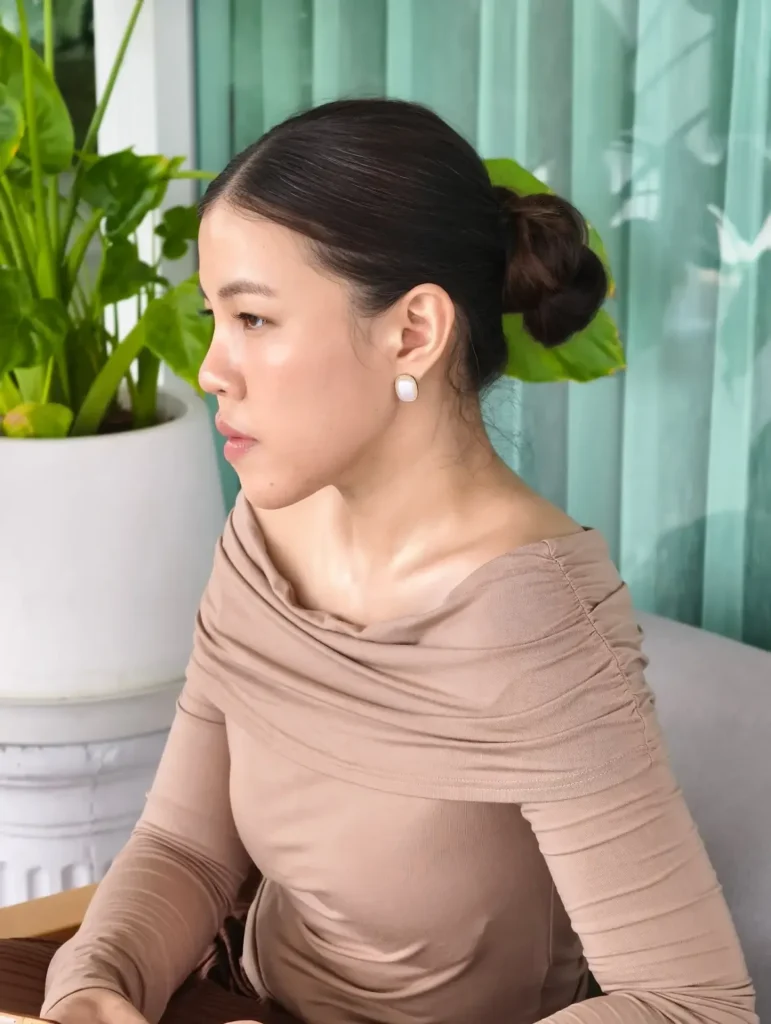 17 Low Bun Hairstyles That Look Effortlessly Chic Without Trying Too Hard 7 Low Bun With a Side Part