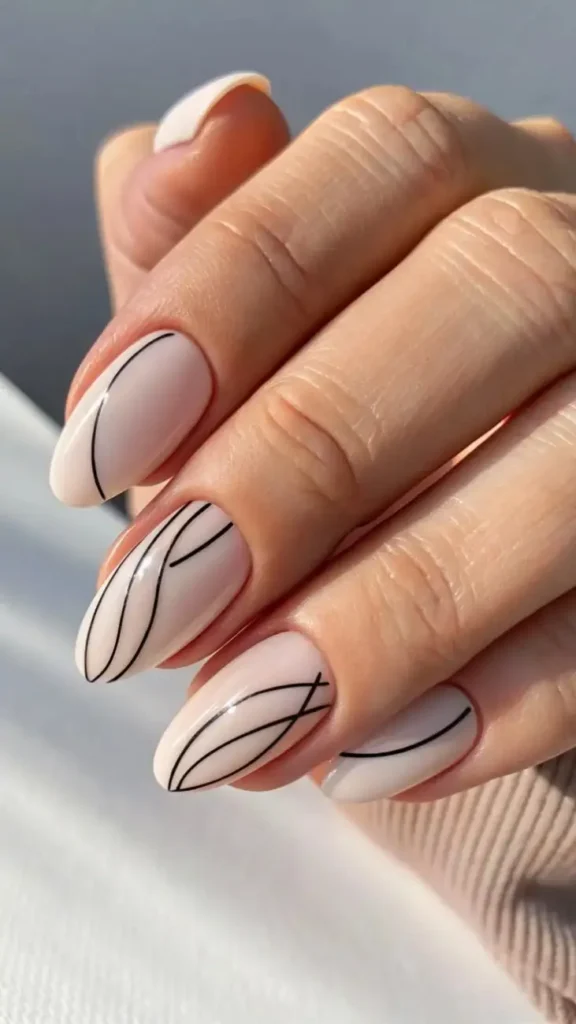 16 Classy Almond Nails That Make Every Outfit Look Expensive (Your New Everyday Nail Obsession) 12 Minimal Line Art Almond Nails 1