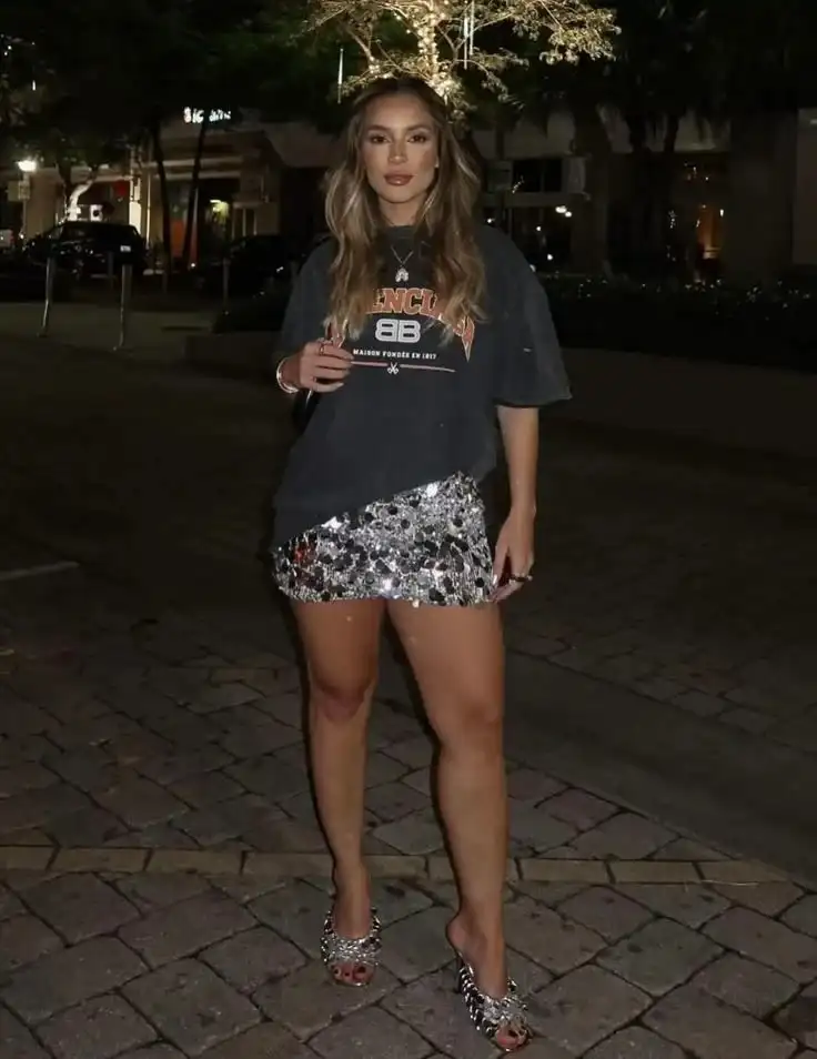 19 Festival Outfit Ideas That Look Cool, Feel Comfy, and Survive the Whole Weekend 11 Sequin Skirt Graphic Tee