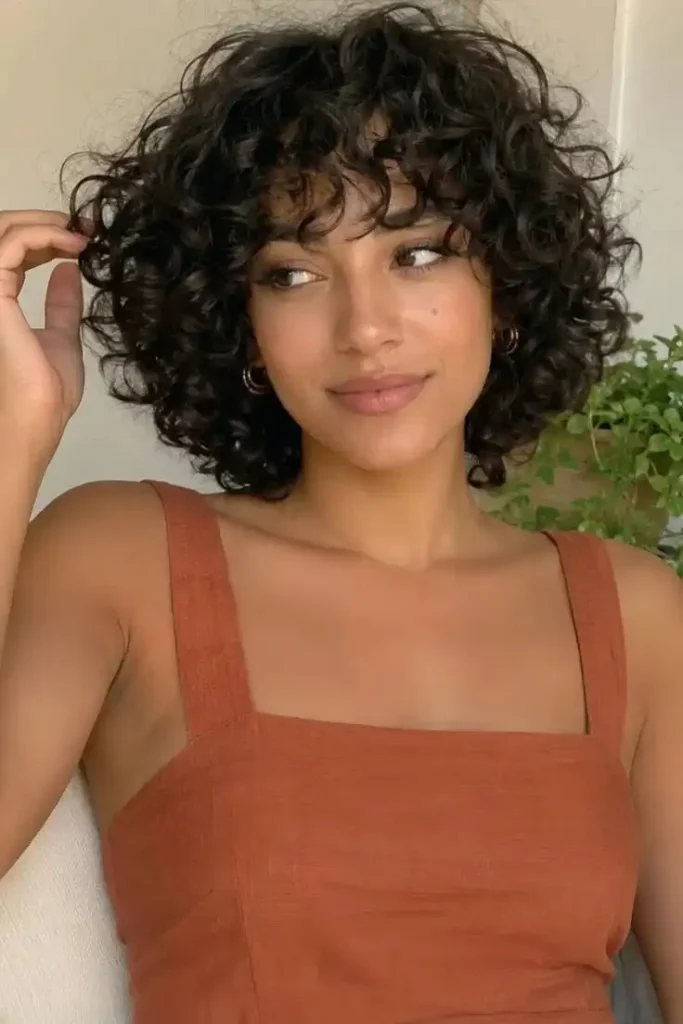 18 Short Dark Hair Ideas That Look Expensive, Chic, and Way Too Easy to Pull Off 12 Short Dark Curly Hair