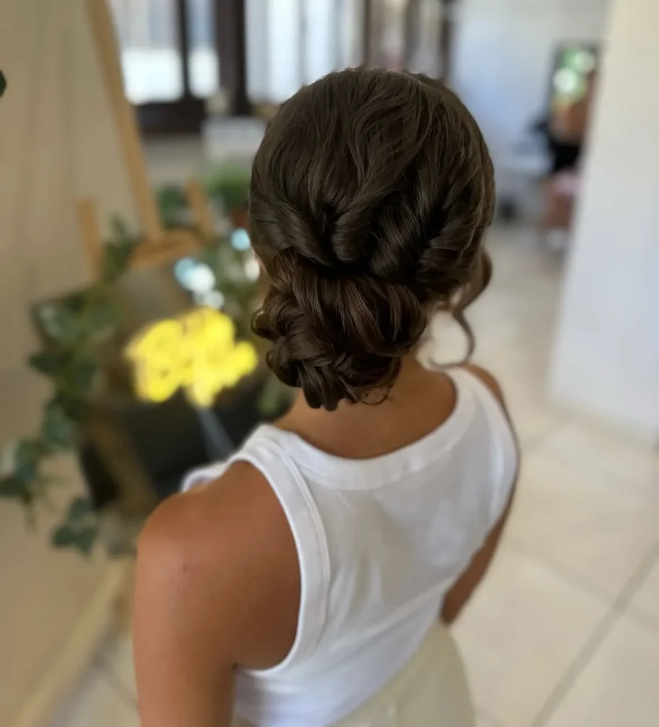 17 Low Bun Hairstyles That Look Effortlessly Chic Without Trying Too Hard 6 Twisted Low Bun