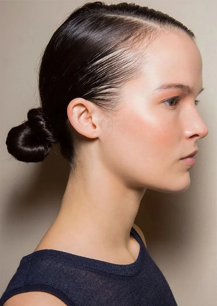 17 Low Bun Hairstyles That Look Effortlessly Chic Without Trying Too Hard 14 Wet Look Low Bun