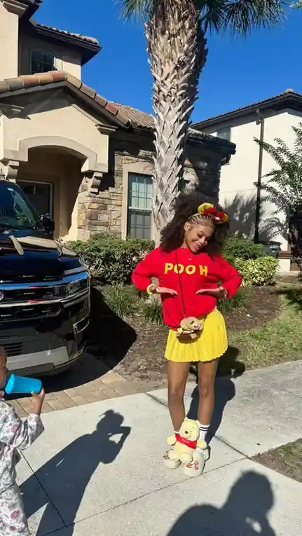 18 Disney Outfit Ideas That Look Magical Without Feeling Like a Costume 6 Winnie the Pooh Yellow and Red Outfit