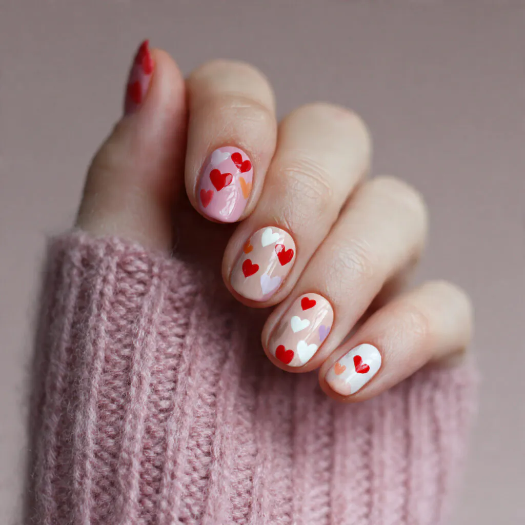 14 Short Oval Nails That Are Cute, Chic, and Seriously Easy to Wear Right Now 12 tiny heart nail art