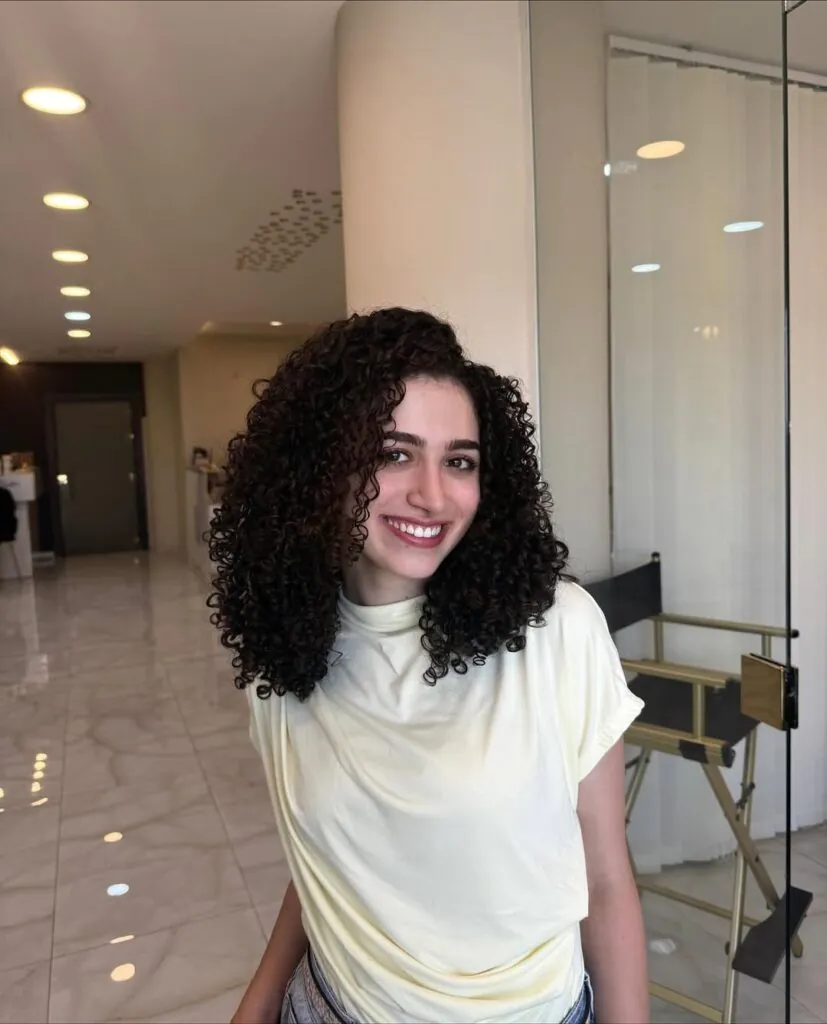 17 Stylish Toddler Hairstyles That Will Make You Want to Try Them Too 3 Bouncy Curls with a Side Part