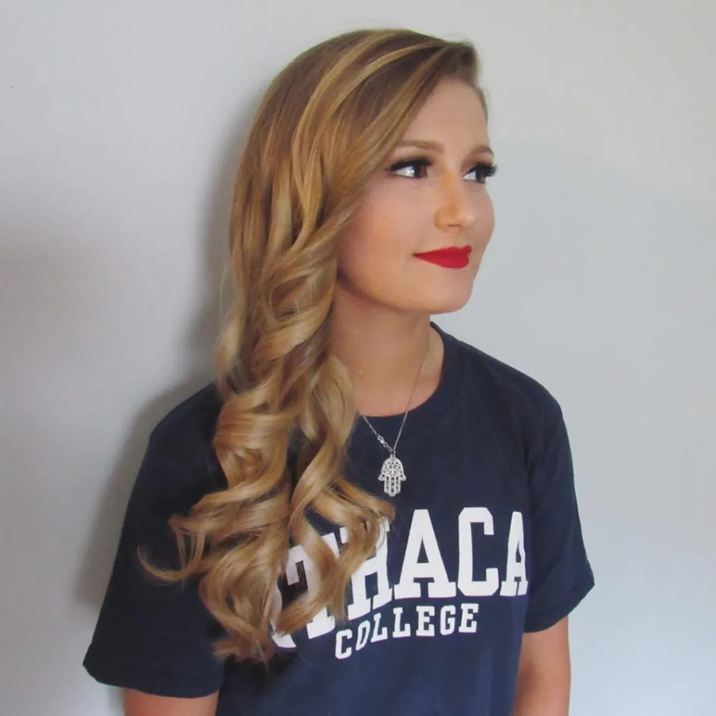 17 Stylish Toddler Hairstyles That Will Make You Want to Try Them Too 13 Side Swept Curls with a Bow